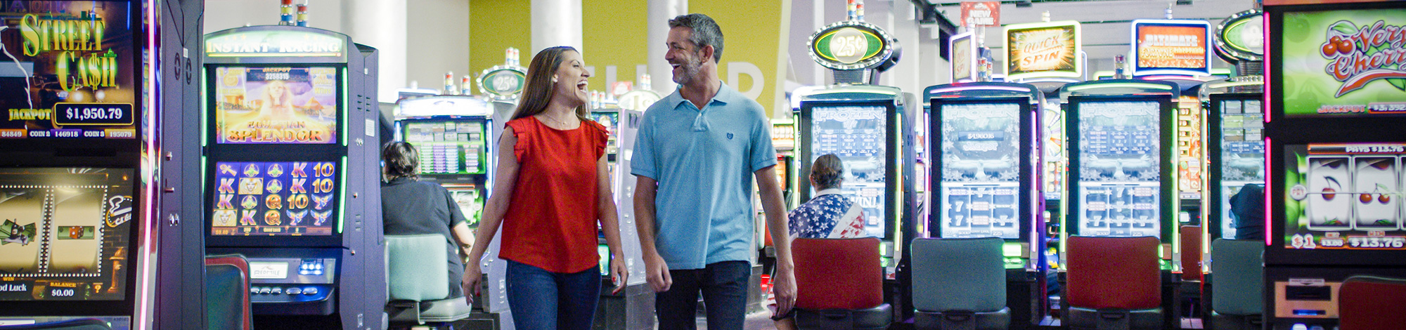 Couple walking through the Red Mile slots floor